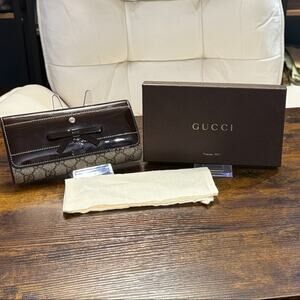 Gucci Brown and Black Wallet on chain.